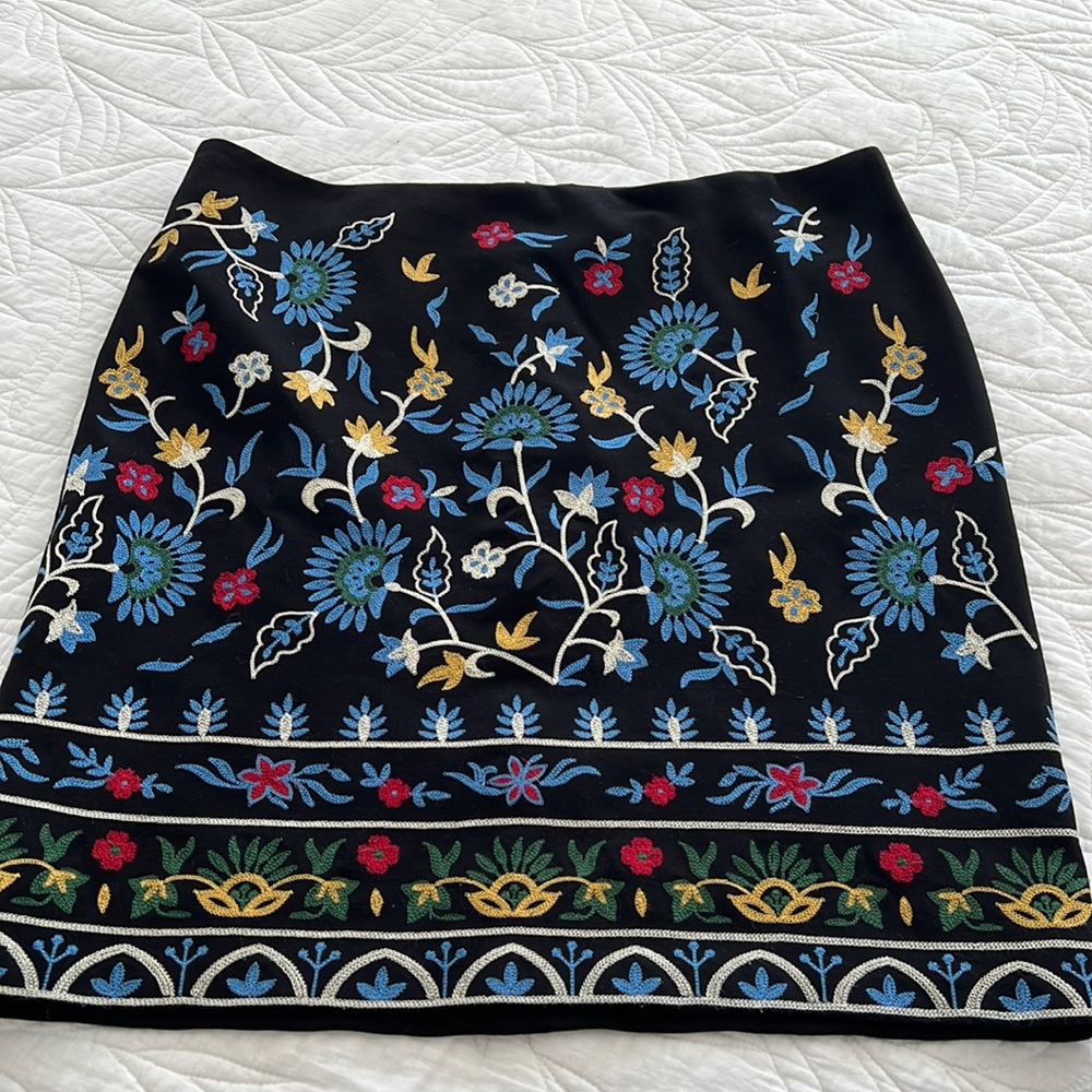 J. Mclaughlin black skirt with embroidered flowers.